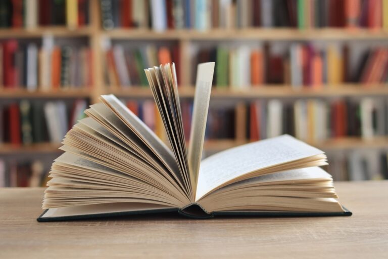 Book,With,Open,Pages,,Close,Up,,Books,On,The,Shelf